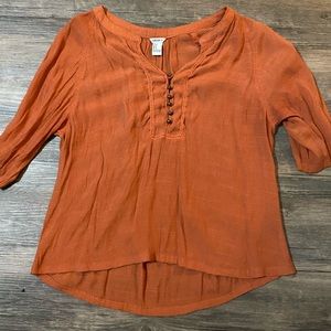 Burnt orange long sleeve blouse.